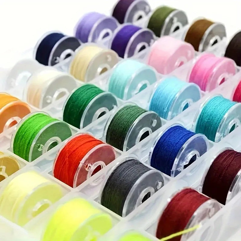 A variety of pre-wound sewing machine bobbins with thread in various colors are displayed in clear plastic packaging.