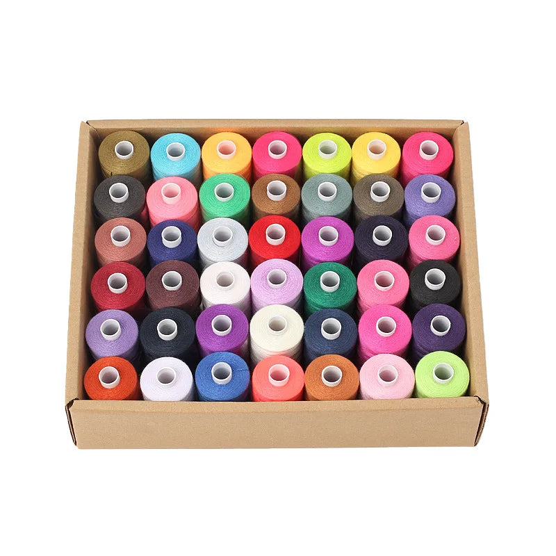 A wooden box filled with 42 colorful polyester thread spools for sewing and quilting.
