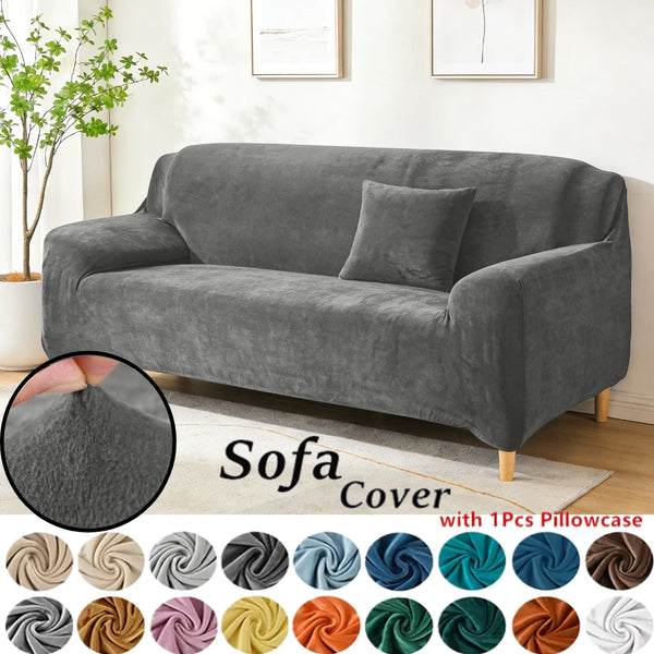 Gray stretch velvet sofa slipcover with various accent pillow covers shown on a light rug.