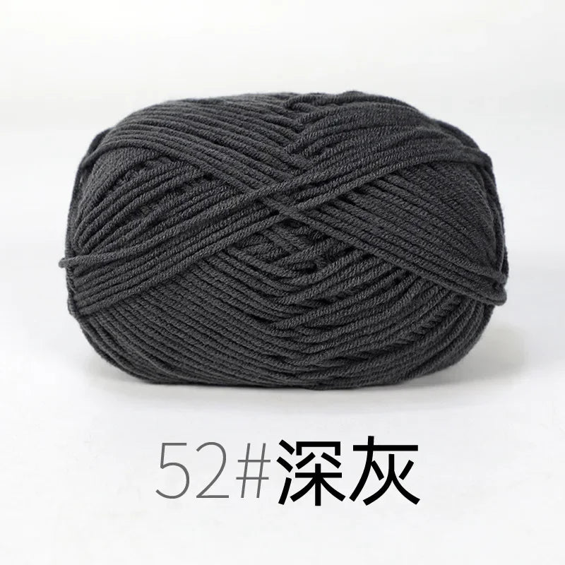 A ball of dark gray organic cotton 4ply knitting yarn for crafts.