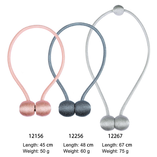 Three magnetic curtain tiebacks in pink, blue-gray, and silver showing different lengths and weights.