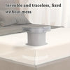 A close-up view of a gray adjustable bed sheet holder with a non-slip grip resting on a white bed sheet.