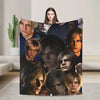 A graphic throw blanket featuring a collage of intense male faces in various lighting and expressions.