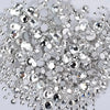 A pile of clear glass rhinestones and sequins for DIY crafts