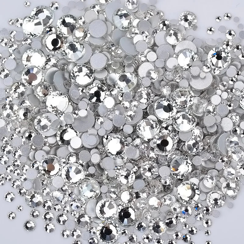 A pile of clear glass rhinestones and sequins for DIY crafts
