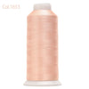 Spool of light peach colored high tenacity machine embroidery thread
