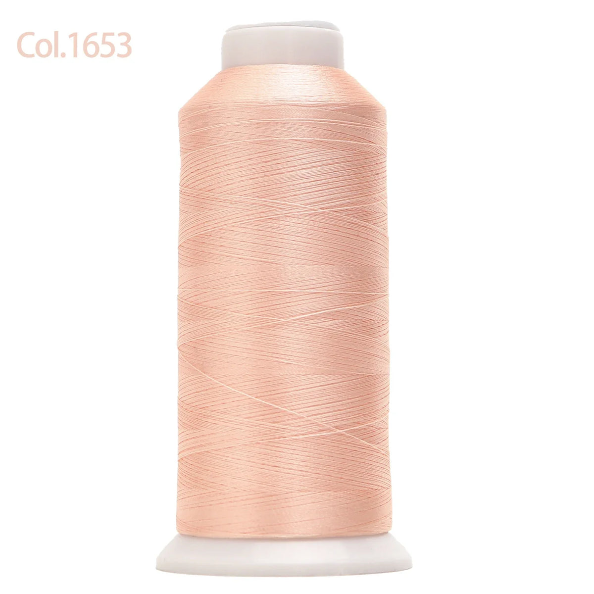 Spool of light peach colored high tenacity machine embroidery thread
