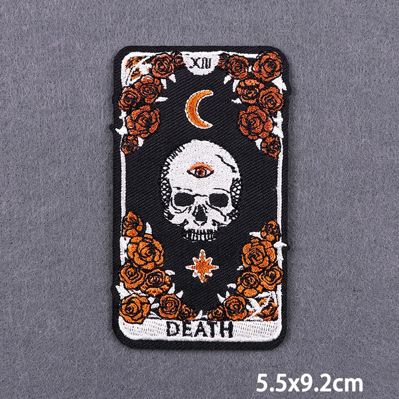 A black embroidery patch featuring a skull and roses, with Roman numerals and the word DEATH below.