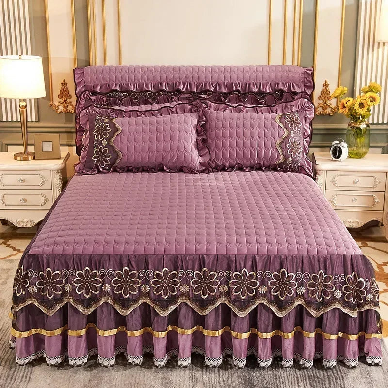 A purple velvet bed skirt with intricate lace trim and gathered hem, displayed on a bed.
