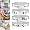 Set of five white adjustable bed sheet organizer straps labeled Twin, Full, King, Queen, and Twin.
