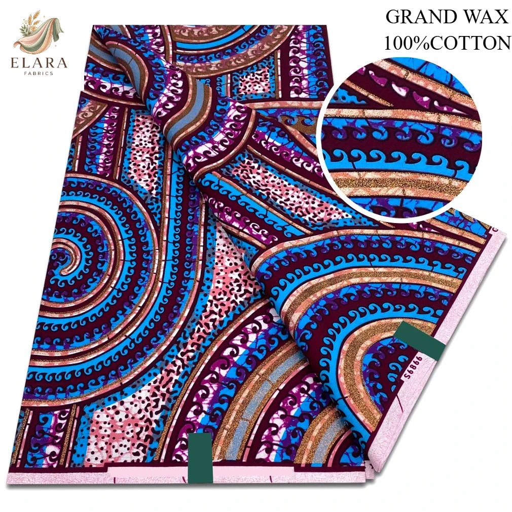 A vibrant purple and pink African wax print fabric featuring intricate swirling patterns.