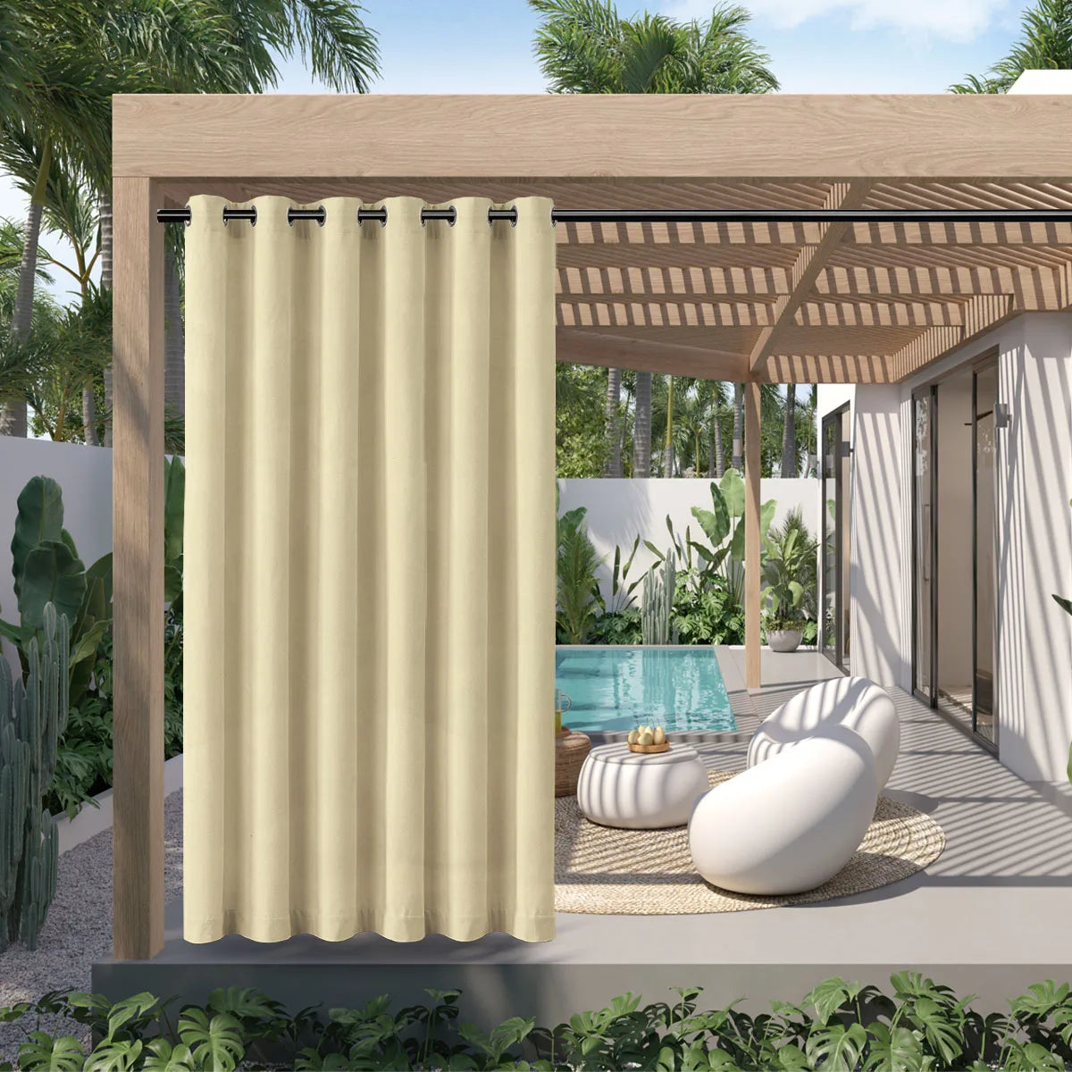 A beige waterproof outdoor curtain with a grommet top hanging in a wooden pergola setting.