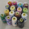 A collection of spools of high tenacity polyester sewing thread in various colors including pink, yellow, green, and black.