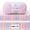 A ball of pink and purple gradient yarn labeled as DAHUAFANGZE for knitting projects