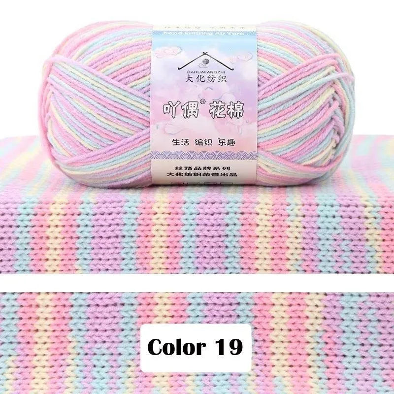 A ball of pink and purple gradient yarn labeled as DAHUAFANGZE for knitting projects