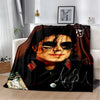 A dark brown flannel throw blanket featuring a portrait of a man wearing sunglasses and a jacket.