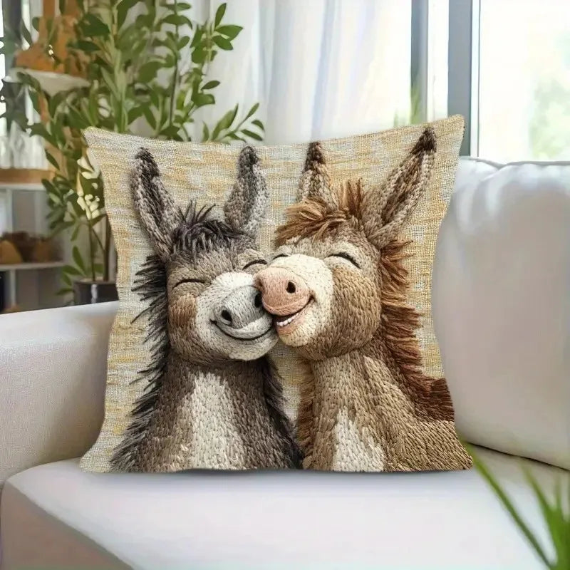 A decorative pillow cover featuring a realistic cartoon depiction of two adorable donkeys.