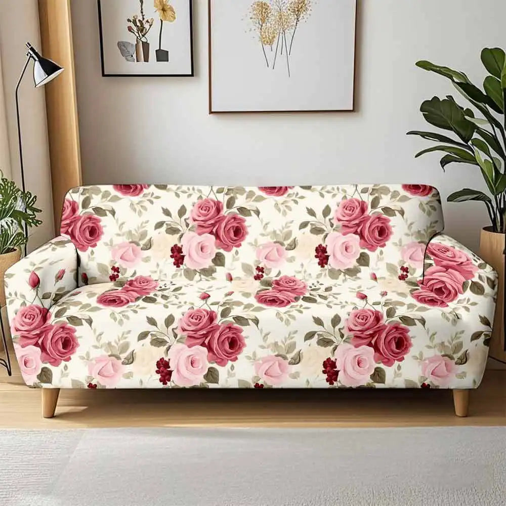 A floral patterned stretch sofa cover featuring pink and cream roses displayed in a bright room.