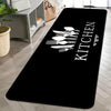 Black non-slip oil-proof floor mat featuring a white silhouette of various kitchen utensils.