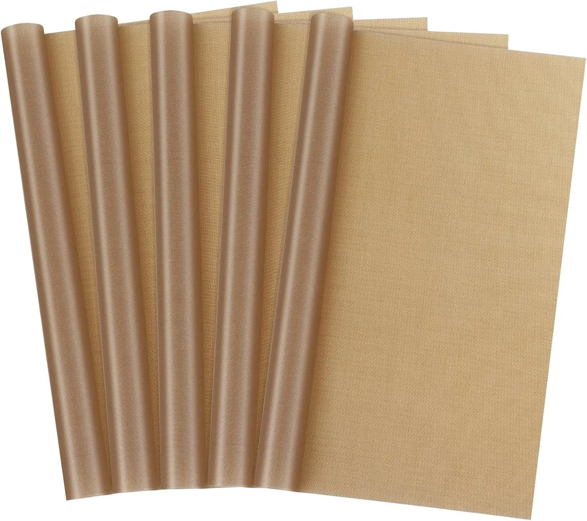 A stack of reusable beige PTFE heat press transfer sheets rolled into tubes.