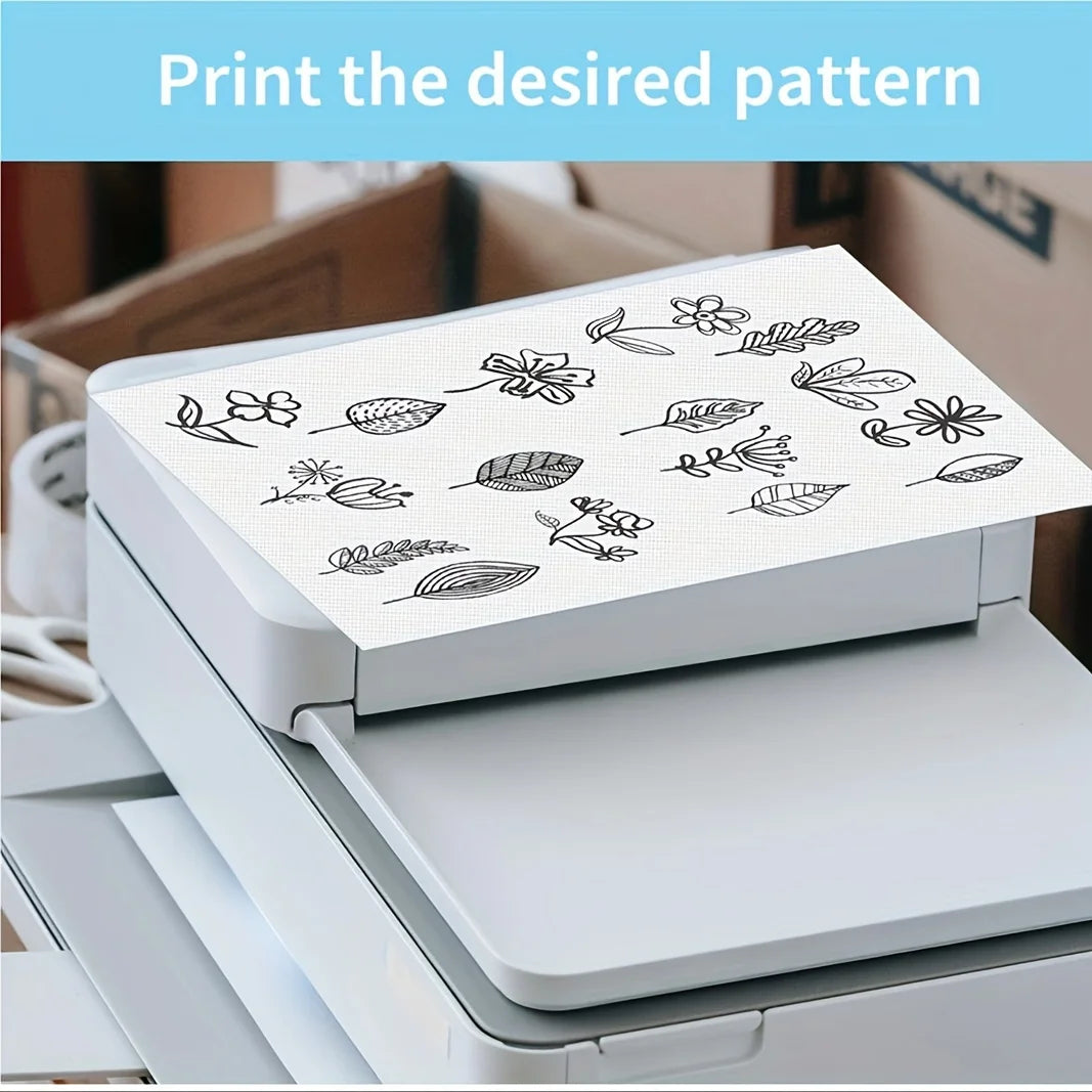 A printer is shown printing a desired pattern onto water-soluble adhesive embroidery stabilizer sheets.
