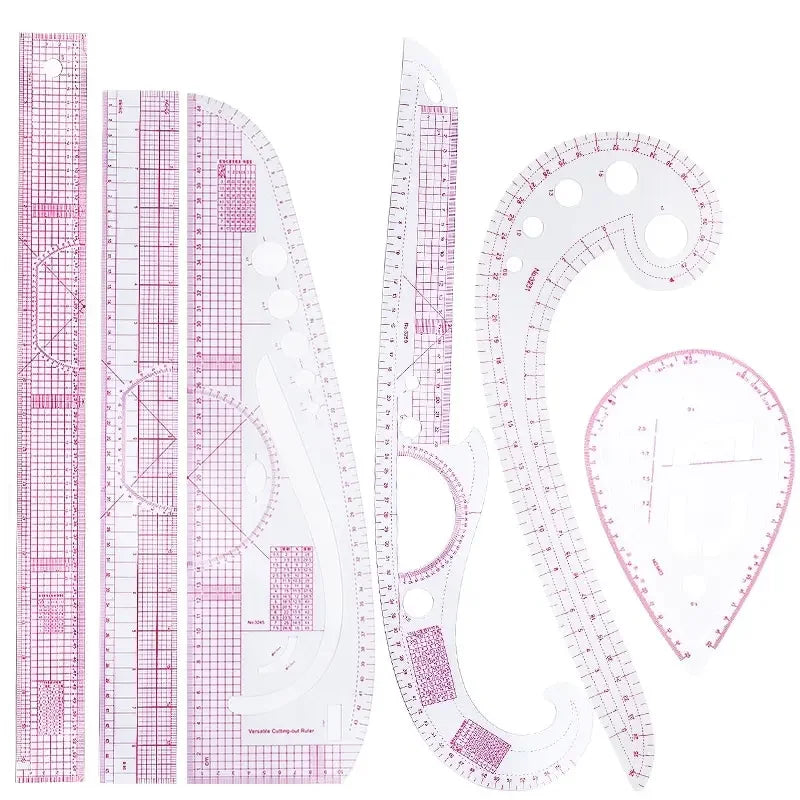 A set of precision sewing rulers and French curve templates for garment making.