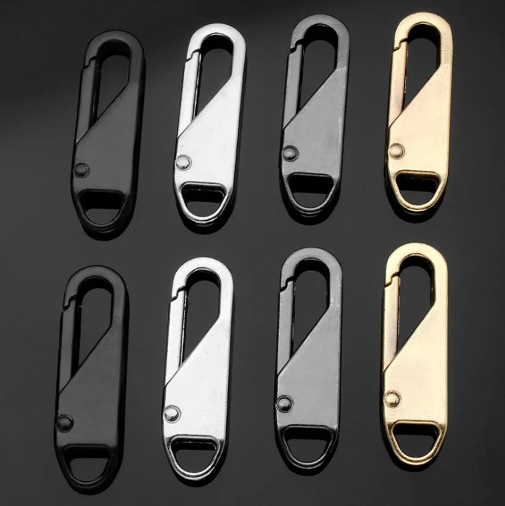 A set of eight metal zipper slider pullers in various finishes and sizes.