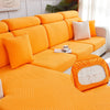 Bright orange jacquard plush sofa cushion covers with geometric patterns and pillows