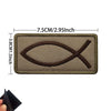 A rectangular brown embroidered patch featuring a cross design on a khaki fabric background.