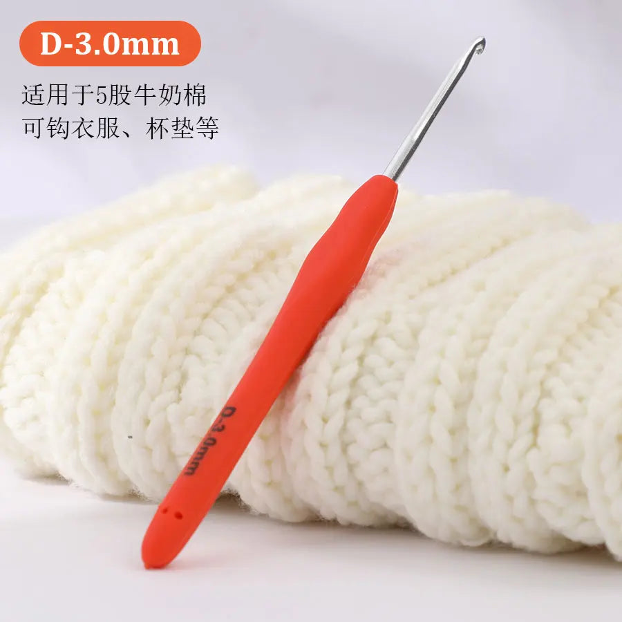 An orange crochet hook with a D-3.0mm size marking is shown next to a ball of white yarn.