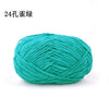 A ball of teal green chenille yarn for knitting and crochet