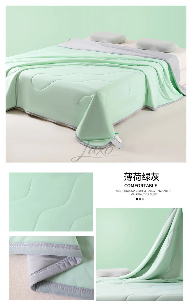 Light green ice silk summer cooling blanket draped over a bed, showing its quilted texture and soft fabric.