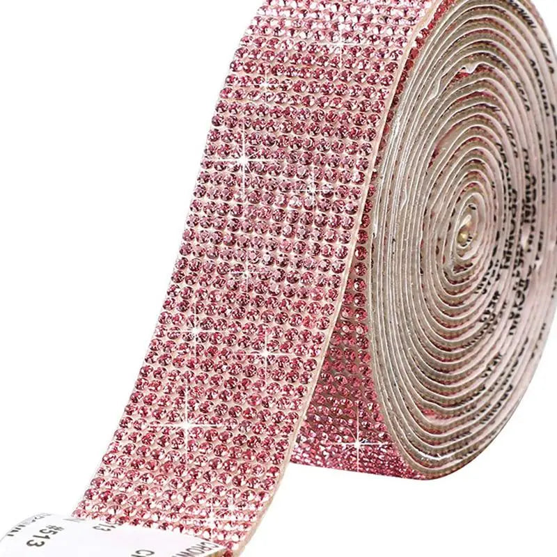 Roll of pink crystal rhinestone sticker ribbon with diamond trim for crafts and decor