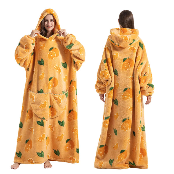 A woman wearing a yellow sherpa fleece oversized blanket hoodie, shown from the front and back.