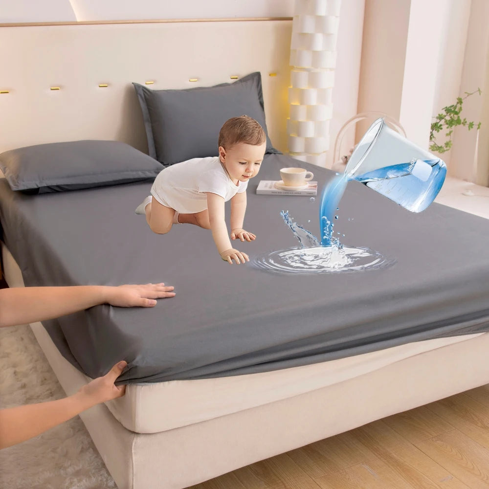 A baby is playing with water pouring from a glass onto a bed sheet.