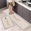 Two rectangular kitchen rugs with a diamond print are displayed on a light wooden floor.