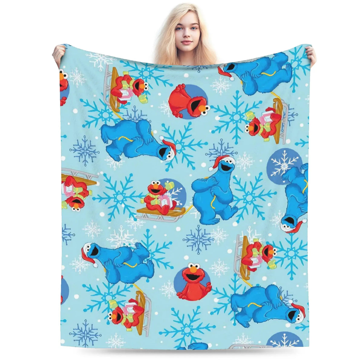 A blue and white flannel throw blanket featuring a cartoon design of Elmo and Friends characters.