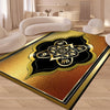 A modern geometric soft area rug featuring gold, black, and bronze tones in a decorative pattern.