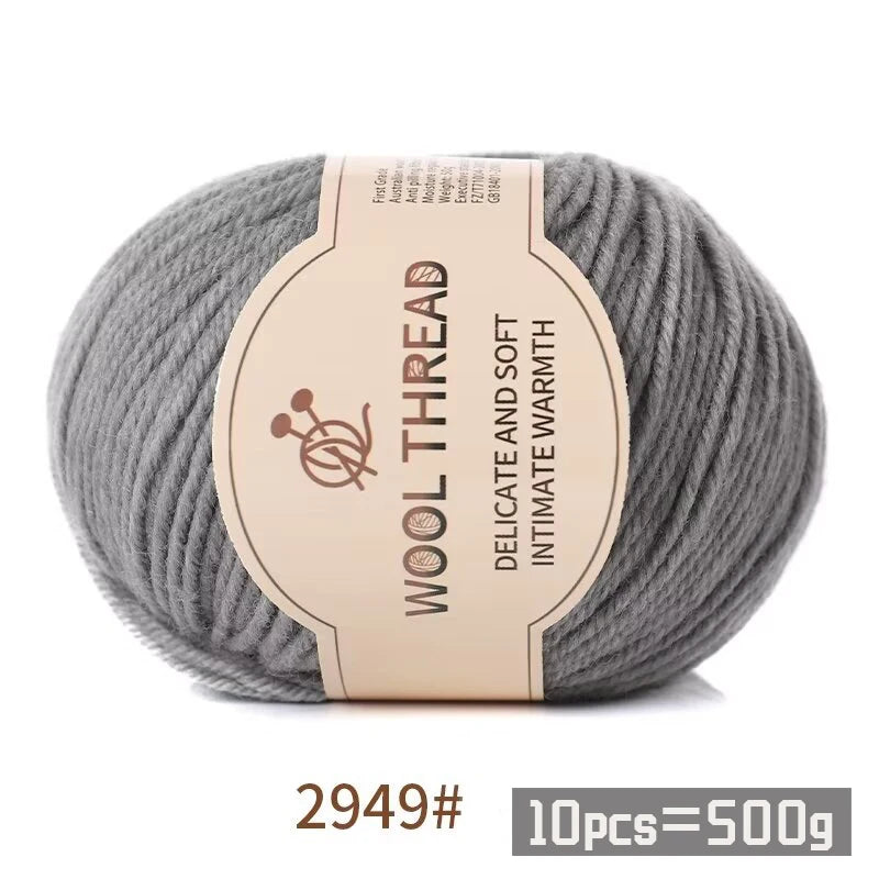 A ball of gray wool thread with a label indicating the product is a Medium Coarse Alpaca Wool Yarn Kit for Knitting.