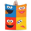 A colorful flannel throw blanket featuring cartoon characters like Elmo and Friends.
