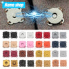 A collection of metal magnetic snap buttons in various colors and shapes for sewing projects.