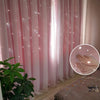 Pink sheer lace curtains with a star pattern hanging in a room