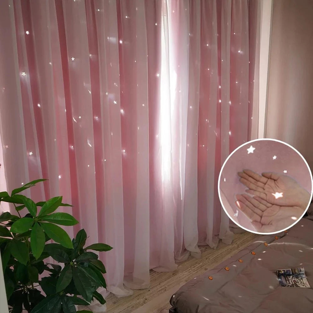 Pink sheer lace curtains with a star pattern hanging in a room