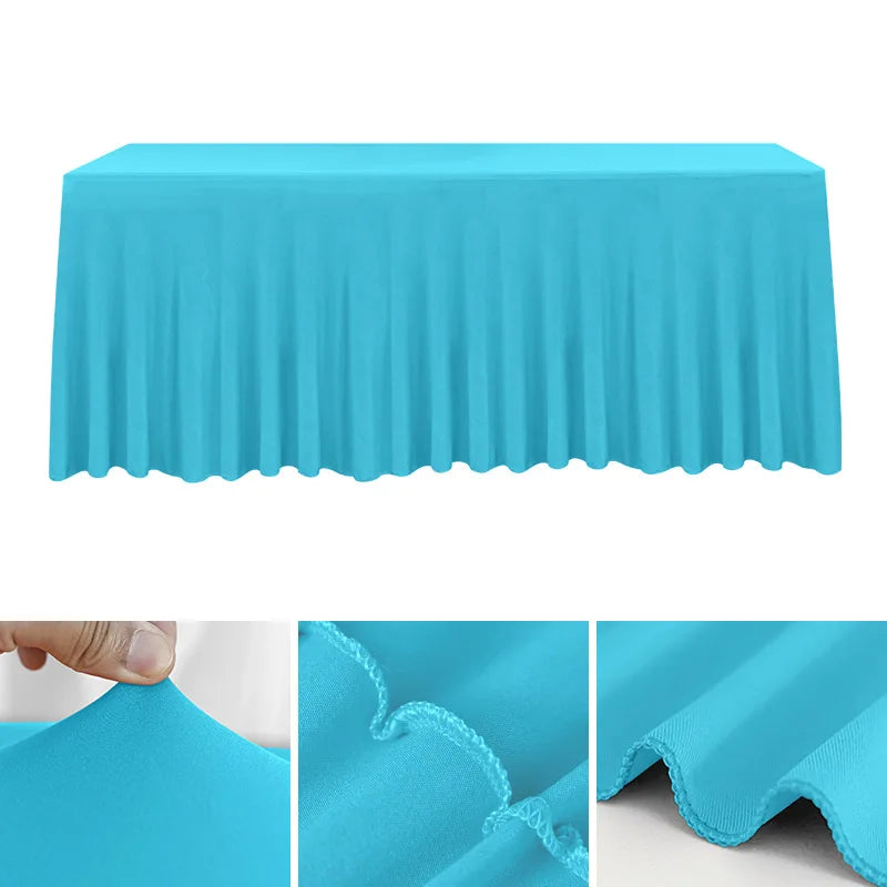 A bright cyan stretchable waterproof rectangle tablecloth draped over a table.