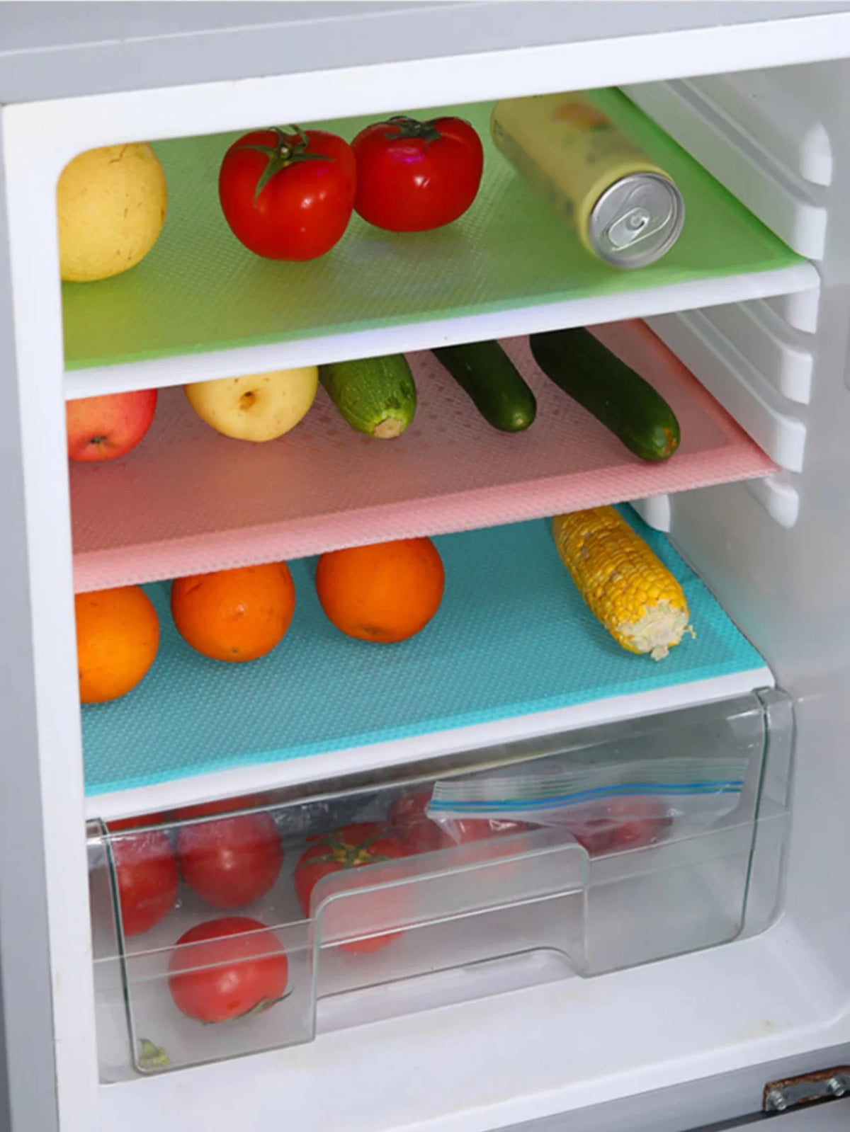 Reusable silicone fridge and drawer liners with various fruits and vegetables stored in compartments