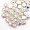 Silver rhinestone buttons shaped like sunflowers arranged in a cluster