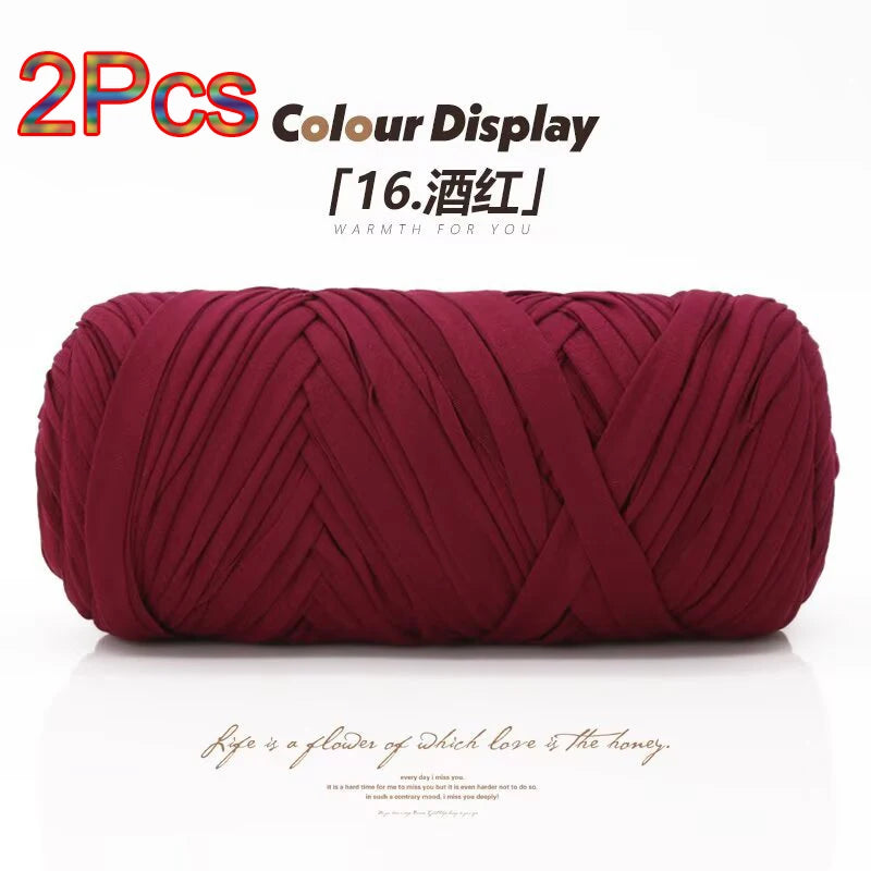 Two crimson elastic yarn skeins displayed on a white background for crafting