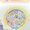 A colorful collection of vintage botanical flower stickers arranged on a yellow plaid plate.