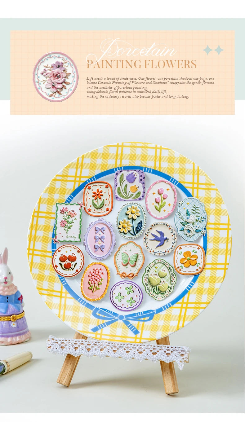A colorful collection of vintage botanical flower stickers arranged on a yellow plaid plate.