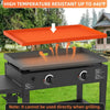 A black grilling unit with an orange high-temperature resistant silicone mat cover shown outdoors.